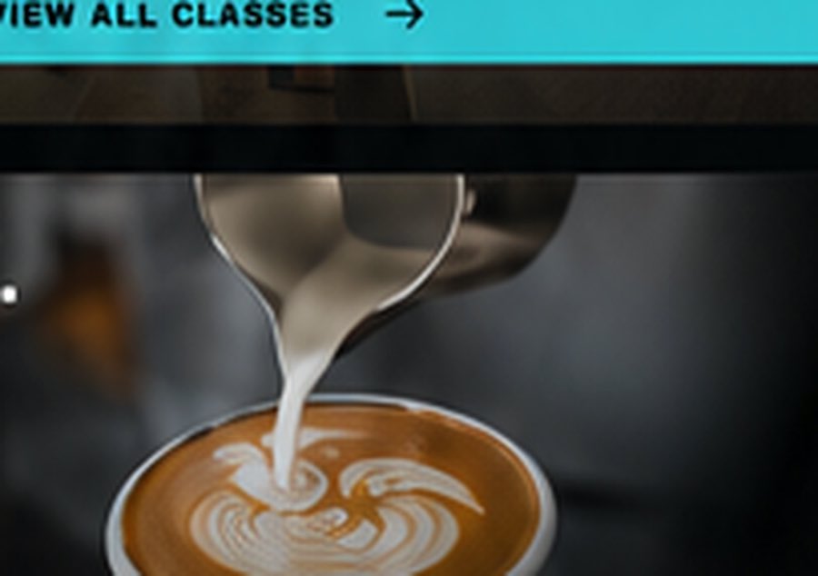 Latte being poured at Community Kitchen & Coffee