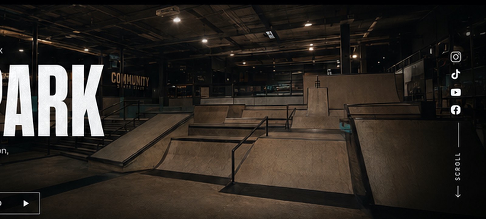 Wide view of the indoor skatepark ramps at Community Skate Club